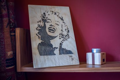 Handmade Wooden portrait of a laughing Marilyn Monroe