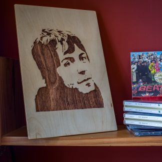 Wooden portrait of a young Paul McCartney