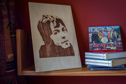 Wooden portrait of a young Paul McCartney