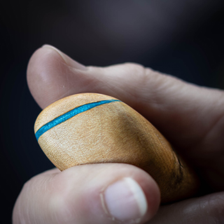 A single, highly polished and smooth wooden 