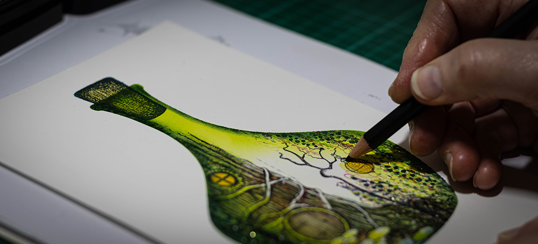 A macro action shot of a hand holding a pencil, shading details onto a hand-inked paper background, capturing the culmination the creative process.