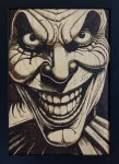 Moody yyrography of a scary clown grinning maniacally